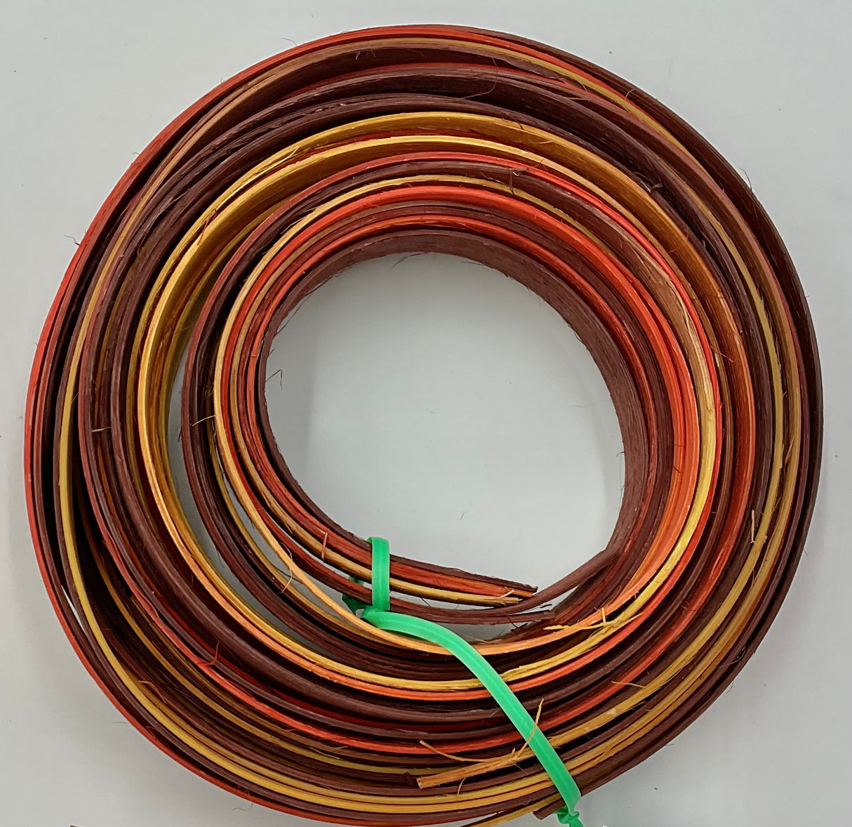 Cornucopia - 1/2" Flat - Variegated/Space Dyed Dyed Reed (1/4 lb coil)